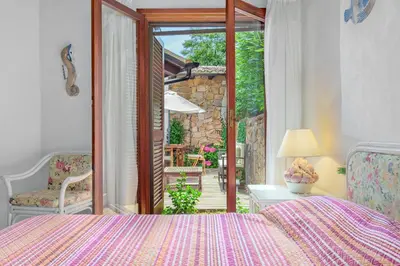 Letto o letti in una camera di Villa Miramar