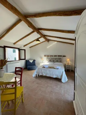 Letto o letti in una camera di Panoramic Loft con uso cucina,Casa Placida - Ammentos