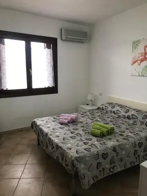 Letto o letti in una camera di Olbia House