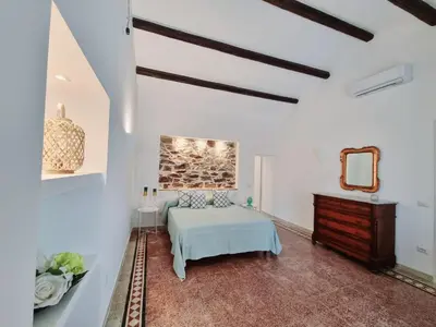 Letto o letti in una camera di STAZZO SAN TEODORO LA QUERCIA Piscina Condivisa