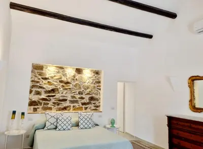 Letto o letti in una camera di STAZZO SAN TEODORO LA QUERCIA Piscina Condivisa
