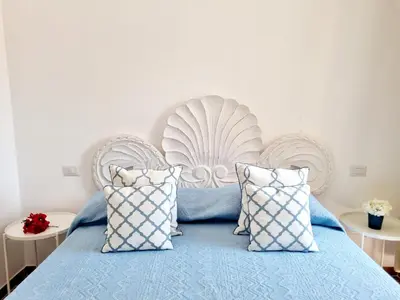 Letto o letti in una camera di STAZZO SAN TEODORO LA QUERCIA Piscina Condivisa