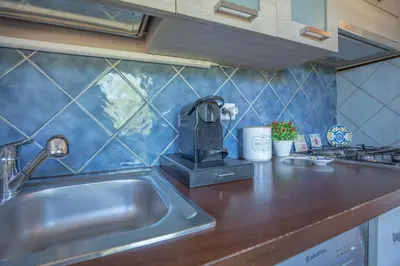 Cucina o angolo cottura di Villa Panoramica Porto Istana