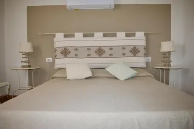 Letto o letti in una camera di Villa con Splendido Giardino e Vista Mare a Osseddu - Olbia