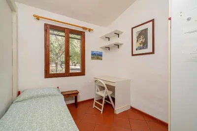 Letto o letti in una camera di Villetta Cala D'Ambra
