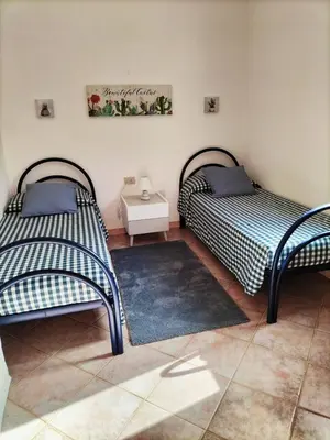 Letto o letti in una camera di Casa Dory