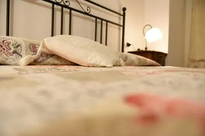 Letto o letti in una camera di Appartamento Mughetto con A/C