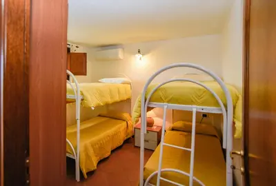 Letto o letti in una camera di Appartamento Mughetto con A/C