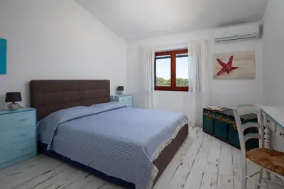 Letto o letti in una camera di Casa dell'Asfodelo by Wonderful Italy