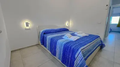 Letto o letti in una camera di MaMa House con vista mare