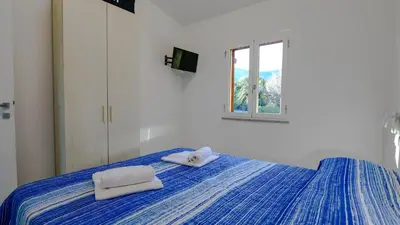 Letto o letti in una camera di MaMa House con vista mare