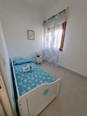 Letto o letti in una camera di Casa Vacanza Boi-Dessena
