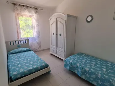 Letto o letti in una camera di Casa Vacanza Boi-Dessena