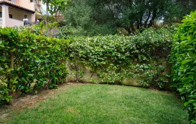 Giardino di Cozy Apartment In Porto San Paolo