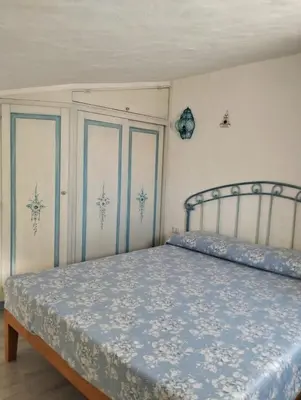 Letto o letti in una camera di Villetta Luna