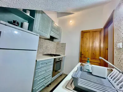 Cucina o angolo cottura di Nel Cortile della Casa di Carta, due Singole Unità
