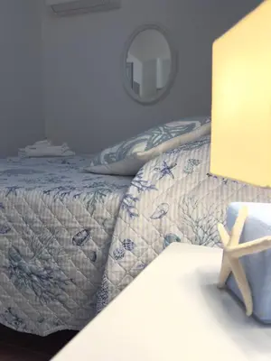 Letto o letti in una camera di Villa Vittoria San Teodoro