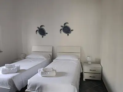 Letto o letti in una camera di Trilo Lu Rattali
