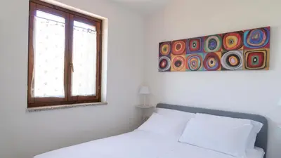 Letto o letti in una camera di Casa della Luna