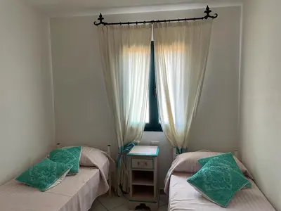 Letto o letti in una camera di Casa Giulia