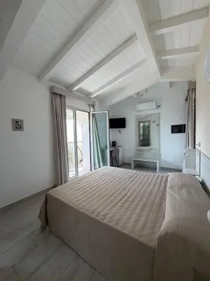 Letto o letti in una camera di Villa Lentischio