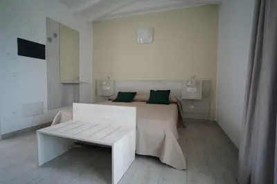 Letto o letti in una camera di Villa Lentischio