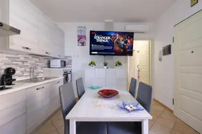 Cucina o angolo cottura di Holiday Olbia - Appartamento a due passi dal lungomare e centro città
