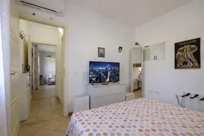 Letto o letti in una camera di Holiday Olbia - Appartamento a due passi dal lungomare e centro città