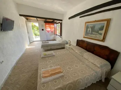 Letto o letti in una camera di Appartamento esinai 2