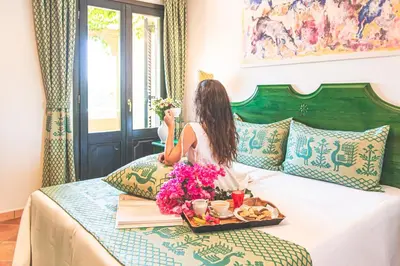 Letto o letti in una camera di Villaggio Cala Ginepro Resort & SPA