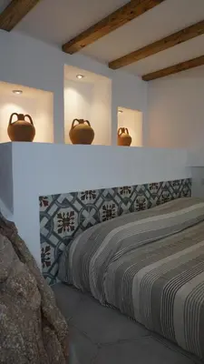 Letto o letti in una camera di Li Petri Manni