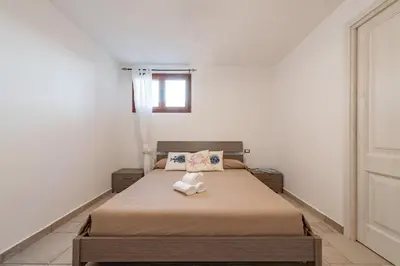 Letto o letti in una camera di AffittaSardegna-Casa Vedetta