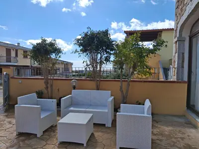 Area soggiorno di La Caletta Vista mare giardino