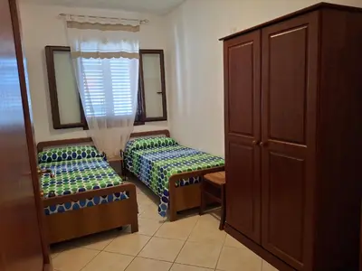 Letto o letti in una camera di La Caletta Vista mare giardino