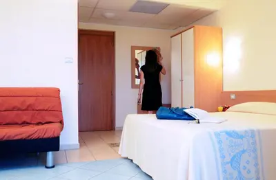 Letto o letti in una camera di Hotel Baia Marina