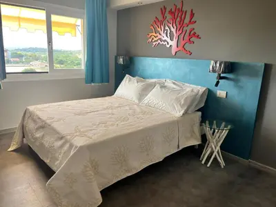 Letto o letti in una camera di RELAIS IL CORALLO
