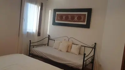 Letto o letti in una camera di Capo Figari 15, Appartamento spazioso nel centro di Golfo Aranci con terrazza, Wi-Fi, parcheggio gratuito