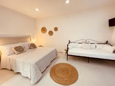 Letto o letti in una camera di B&B Dimora Dorgali