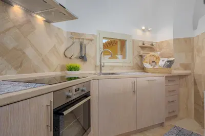 Cucina o angolo cottura di Appartamento Smeralda - SHERDENIA Luxury Apartments
