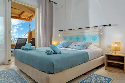 Letto o letti in una camera di Appartamento Smeralda - SHERDENIA Luxury Apartments