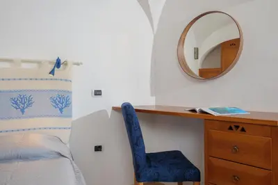 Letto o letti in una camera di Villetta Azzurro - SHERDENIA Luxury Apartments