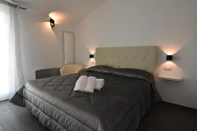 Letto o letti in una camera di CAVOUR ROOMS