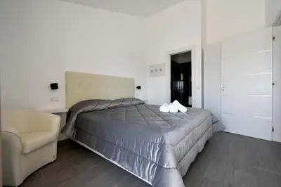 Letto o letti in una camera di CAVOUR ROOMS