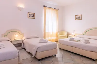 Letto o letti in una camera di Hotel Cavour