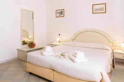 Letto o letti in una camera di Hotel Cavour