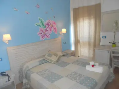 Letto o letti in una camera di Hotel Tabby