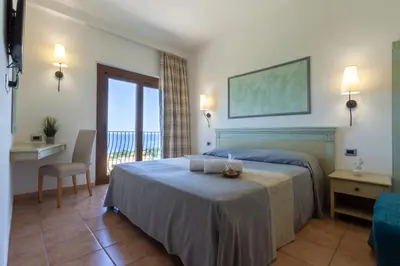 Letto o letti in una camera di Hotel Brancamaria