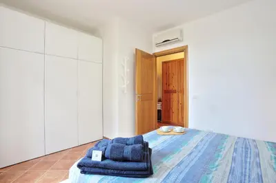 Letto o letti in una camera di Isola Blu, Jacuzzi & Pool by DomusAway