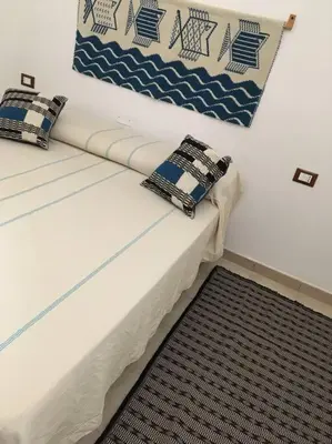 Letto o letti in una camera di Sardinia House