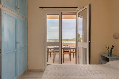 Letto o letti in una camera di Residence Baia de Bahas Golfo di Marinella